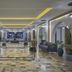 Hilton Skanes Monastir Beach Resort lobby with modern seating, arched hallways and ocean view in Monastir