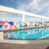 Rooftop pool at ibis budget Singapore Selegie with colorful mural wall and open sky