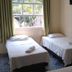 Hotel Vale Verde Penedo guest room with three single beds and a window view in Penedo