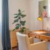 Les Suites de Bellac guest room desk with chair, lamp, plant, electric kettle and coffee machine in Bellac