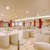 SBH Monica Beach Resort in Costa Calma lounge with round white seating and red columns
