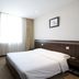 Beijing Northern Langyue Hotel Financial Street Branch guest room with bed, TV and window in Beijing