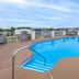 Days Inn by Wyndham Harrisonburg rooftop pool with city and mountain views