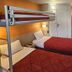 Premiere Classe Strasbourg Ouest twin room with bunk bed, two single beds, desk and wall fan