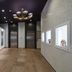 Jr-East Hotel Mets Nagaoka lobby hallway with elevators, framed art, and chandelier lighting in Nagaoka