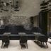 Mana Sleep & Spa in Druskininkai lobby seating with geometric ceiling lights and black lounge chairs