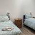 Deepcut Lodge Bed & Breakfast Self Service in Camberley twin room with two single beds and bedside tables