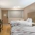Red Roof Inn Detroit-Rochester Hills/Auburn Hills room with two beds and wall-mounted TV in Rochester Hills