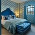 Hotel du Vin Henley guest room with blue patterned wallpaper, double bed and window in Henley-on-Thames