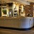 Greswolde Arms by Chef & Brewer Collection in Solihull, hotel bar with long wooden counter and brick pillar