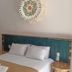 Hospedagem Central in Tiradentes room with double bed and bunk bed beside it