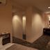 Center Hotel Toyota guest room with sofa, desk, mirror and carpeted floor in Toyota