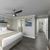 Westgate Branson Lakes Resort in Hollister: guest room with king bed, ceiling fan, and lake art