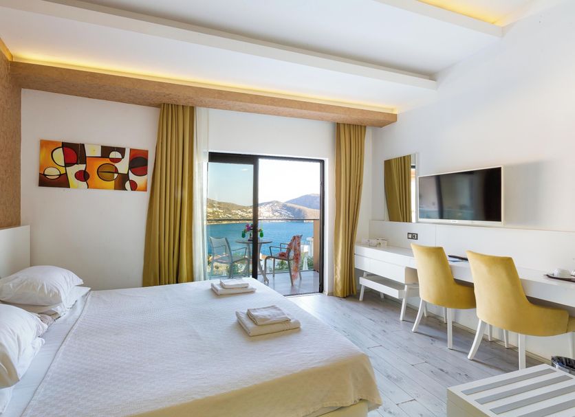 Rhapsody Hotel & Spa Kalkan room with balcony sea view, desk, twin chairs and bed