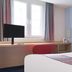 Travelodge Hull South Cave room in Brough with bed, desk, TV and window