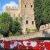 Relais Le Betulle in Conegliano with a hillside stone castle and heart-decorated foreground