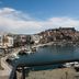 Panorama Junior Suites in Kavála with balcony view over the harbor and hillside cityscape