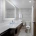 Holiday Inn Express Pensacola Beach by IHG bathroom with double vanity and toilet