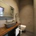 Valerius Boutique Hotel bathroom in Wormerveer with vessel sink, wall mirror and walk-in shower