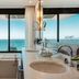 Pestana Rio Atlântica bathroom with soaking tub and floor-to-ceiling ocean view in Rio de Janeiro