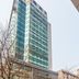 Atour Hotel Dalian Zhongshan Plaza in Dalian, tall glass hotel tower with street-level exterior