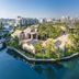 Lawhill Luxury Apartments in Cape Town with waterfront villas, palm trees and city buildings