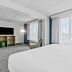 Spark by Hilton Mechanicsburg Harrisburg West guest room with large windows and flat-screen TV