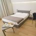 Hotel di Varese room with double bed, bedside table, desk, and breakfast tray in Varese