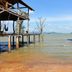 Lanta White Rock in Ko Lanta with overwater bungalows above the sea and a sandy shoreline