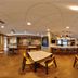 Fairfield by Marriott Inn & Suites Milwaukee Brookfield dining area with tables, chairs, and a breakfast counter in Brookfield.