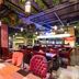 SureStay Plus by Best Western T Pattaya in Chonburi, stylish restaurant with hanging plants and red seating