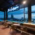 Rooftop bar at SureStay Plus by Best Western T Pattaya in Chonburi with city skyline and pool view