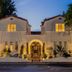 Donatella Boutique Hotel in Miami Beach exterior at dusk with lit entrance and palm trees
