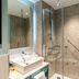 Hyatt Place London City East bathroom with glass-enclosed shower and vessel sink in London