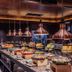 Nysa Hotel Bangkok Sukhumvit 11 breakfast buffet with hanging copper lights in Bangkok