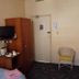 The New Globe Inn, Malton guest room with TV, wardrobe, kettle station and chair