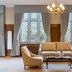 Ashdown Park Hotel & Country Club lounge in East Grinstead with sofa, armchairs, chandelier and tall windows