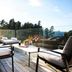 Hotel Arima & Spa in San Sebastian terrace with lounge chairs, glass railing, and outdoor seating