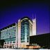 Li An Hotel in Hohhot exterior at night with glass tower and lit facade