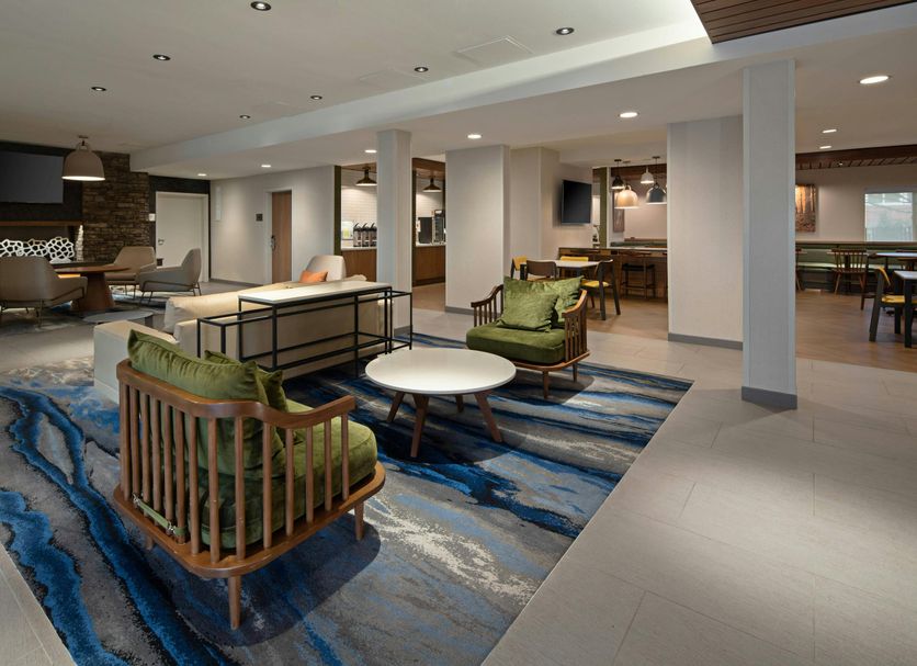 Fairfield by Marriott Inn & Suites Seattle Sea-Tac Airport lobby with seating area and blue patterned rug