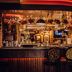 The Torrance Hotel Glasgow bar with festive decor, lit counter, and Christmas tree
