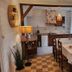 Le Clos Loret in Saint-Germain-du-Corbéis dining room with table, chairs and small kitchen area