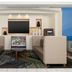 Holiday Inn Express & Suites Las Vegas Sw Springvalley lobby seating area with TV and brochure rack