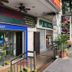 Vintage Inn Boutique Capsule @ Little India exterior on a Little India sidewalk beside nearby restaurants
