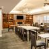 Residence Inn by Marriott Colorado Springs North/Air Force Academy breakfast area with tables and fireplace