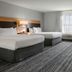 TownePlace Suites by Marriott Ontario Airport room with two beds, TV, and seating in Rancho Cucamonga