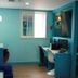 Time Motel, Gyeongju: colorful guest room with desks, chairs, and a window