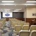 Hampton by Hilton Minsk City Centre meeting room with rows of chairs and presentation screen