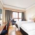 Thon Hotel Saga, Haugesund guest room with two beds, chairs, and a window view