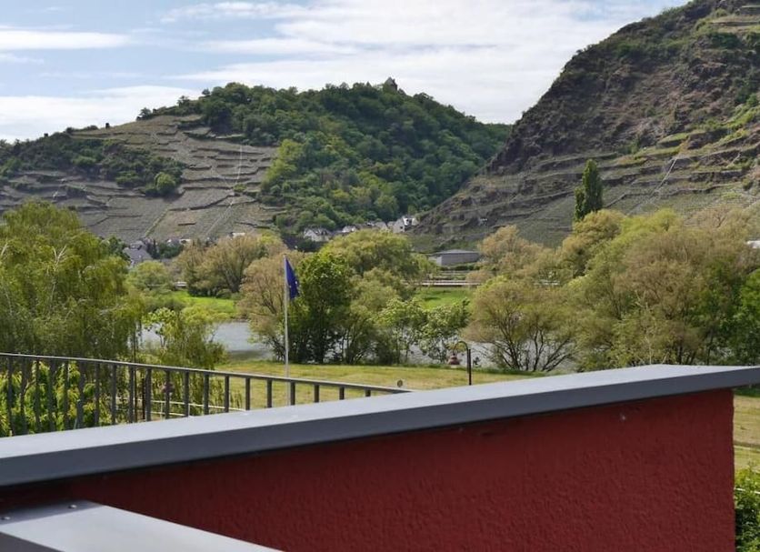 Hotel Kachelburg in Dieblich with terrace view of green hills and a river valley